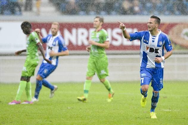 20140817 - GENT, BELGIUM: Gent s Danijel Milicevic celebrates after scoring during the Jupiler Pro League match between KAA Gent and Zulte Waregem, in Gent, Sunday 17 August 2014, on day 4 of the Belgian soccer championship. LAURIExDIEFFEMBACQ 04280382