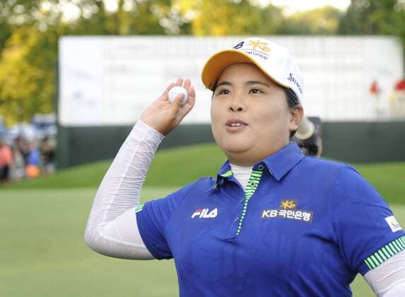 Aug. 17, 2014 - Pittsford, NY, U.S. - August 17, 2014: Inbee Park tosses her winning golf ball to the crowd after winning the Wegmans LPGA Golf Damen Championship at the Monroe Golf Club in Pittsford, NY. LPGA Golf Damen 2014: Wegmans LPGA Golf Damen Championship AUG 17 - ZUMAsw6