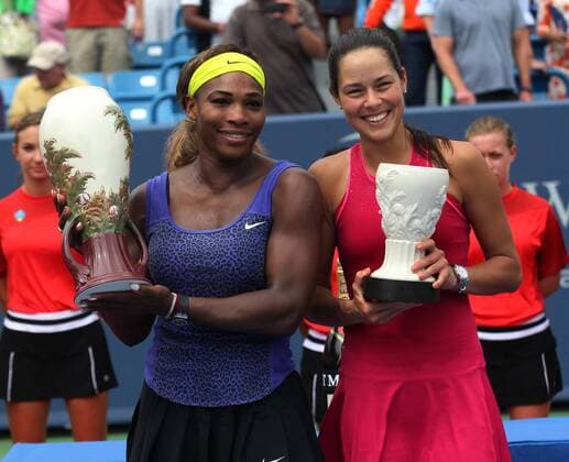 Aug. 17, 2014 - Cincinnati, Ohio, U.S - Serena Williams holds up the Championship Rookwood cup on the left . As she stand next to Ana Ivanovic who lost to Williams on Sunday August 17, 2014 in the Western & Southern Open in Cincinnati, Ohio. Western & Southern Open tennis - ZUMAc19