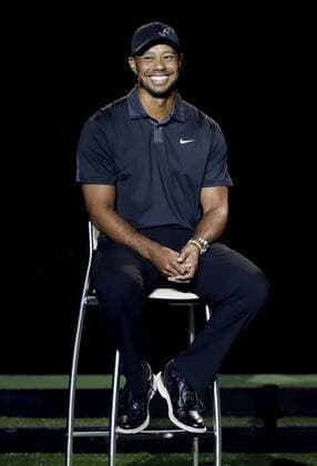 Tiger Woods smiles while on stage at the launch of the new Nike Vapor Iron Franchise at Liberty National Golf Club in Jersey City, NJ on August 18, 2014. The Vapor Iron Franchise consists of 3 sets of golf club irons; The Vapor Pro, Vapor Pro Combo and Vapor Speed.  NYP20140818117