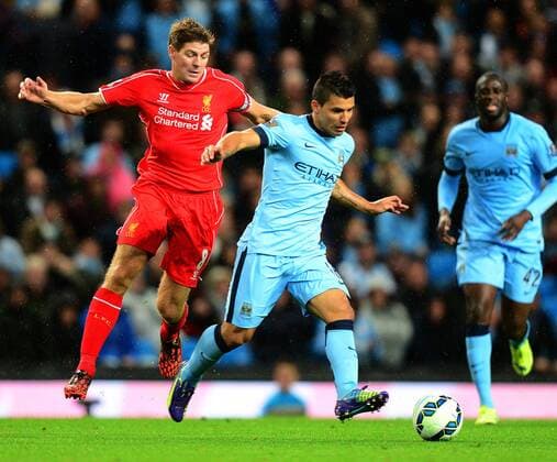 Steven Gerrard of Liverpool tussles with Sergio Aguero of Manchester City - Barclays Premier League - Manchester City vs Liverpool - Etihad Stadium - Manchester - England - 25th August 2014 - Pic Simon Bellis Sportimage EDITORIAL USE ONLY. No use with unauthorised audio, video, data, fixture lists, club league logos or live services. Online in-match use limited to 120 images, no video emulation. No use in betting, games or single club league player publications.