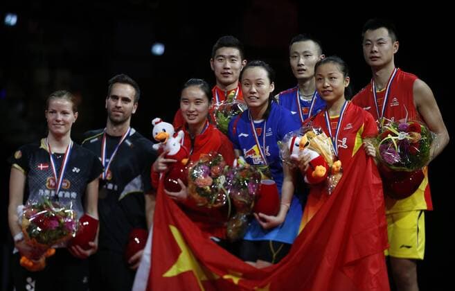 COPENHAGEN -- (From L to R) Christinna Pedersen and Joachim Fischer Nielsen of Denmark, Bao Yixin, Liu Cheng, Zhao Yunlei, Zhang Nan, Ma Jin and Xu Chen of China pose during the awarding ceremony for the Mixed Doubles Final on Day 7 of Li Ning BWF World Championships 2014 at Ballerup Super Arena in Copenhagen, Denmark on Aug. 31, 2014. 