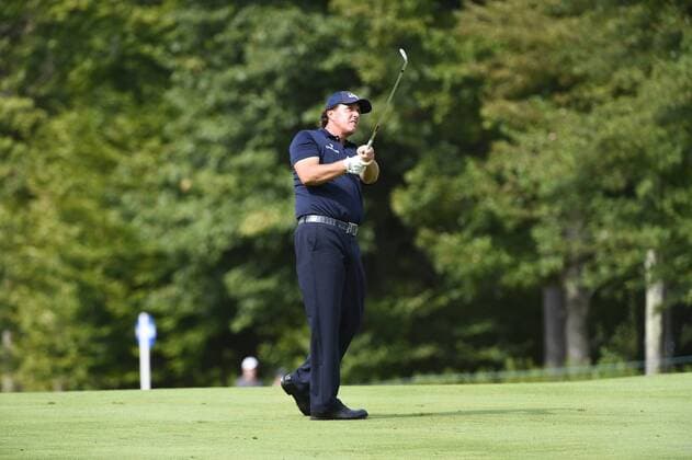 Aug. 31, 2014 - Norton, Massachusetts, USA - August 31, 2014 - Norton, Mass. - Phil Mickelson watches his ball s flight to the 5th green during the third round of the PGA Golf Herren FedEx Cup playoffs, Deutsche Bank Championship, held at the Tournament Players Club in Norton Massachusetts. Eric Canha CSM Golf 2014: Deutsche Bank Championship AUG 31 - ZUMAc04