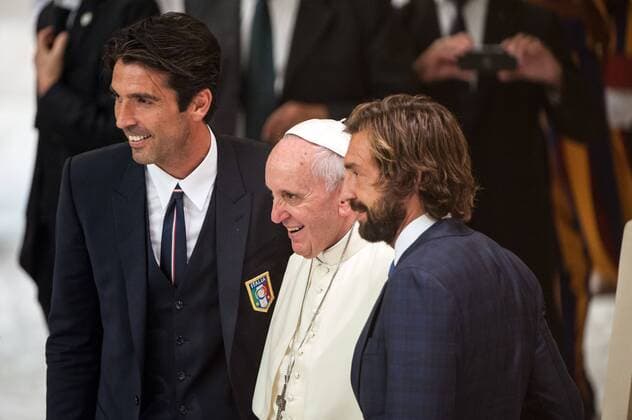 September 1, 2014: Italy s football player Gianluigi Buffon (L) and Andrea Pirlo pose with Pope Francis (C) at the Vatican during a meeting with organizers, players and guests of the inter religious match for peace football game, played tonight at Rome s Olympic Stadium. 