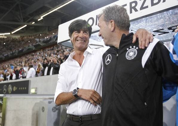 Germanys head coach Joachim Jogi Löw (L) smiles with Andreas Köpke during the friendly match between Germany and Argentina, Signal Iduna Park in Dortmund on September 03., 2013. Länderspiel von Weltmeister Deutschland gegen Argentinien beim Testspiel in Hinblick auf die Qualifikation der Europameisteraschaft 2016.