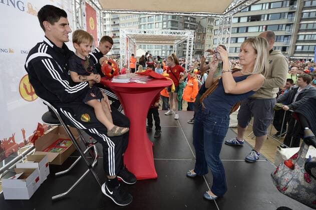 - OOSTENDE, BELGIUM: Belgium s goalkeeper Thibaut Courtois (L) poses with fans at a fan day of Belgian national soccer team Red Devils, Saturday 06 September 2014, in Oostende. YORICKxJANSENS  premiumd 04309219