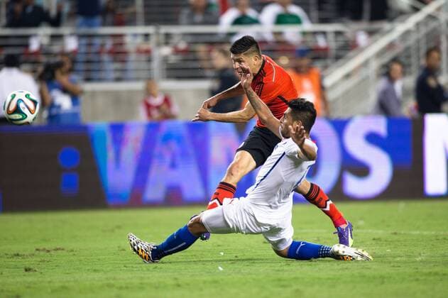 September 06, 2014: Mexico forward Oribe Peralta (19) tries a shot on goal but is blocked by Chile defender Gonzalo Jara (18), during the game between Mexico and Chile at Levi s Stadium in Santa Clara. The game ended in a 0-0 draw. SOCCER: SEP 06 Mexico v Chile Icon20140906051 EDITORIAL USE ONLY