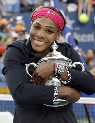 Serena Williams hugs the championship trophy at the US Open Tennis Championships Woman s Final at the USTA BillieJeanKing National Tennis Center in New York City on September 7, 2014.  NYP20140907179
