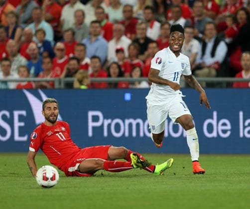 Switzerland s Valon Behrami tussles with England s Raheem Sterling - Euro 2016 Qualifier Group E - Switzerland Vs England - St Jakob Park - Switzerland - 8th September 2014 - Picture David Klein Sportimage EDITORIAL USE ONLY. No use with unauthorised audio, video, data, fixture lists, club league logos or live services. Online in-match use limited to 120 images, no video emulation. No use in betting, games or single club league player publications.