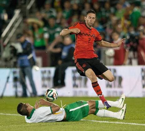 Sept. 9, 2014 - Commerce City, Colorado, U.S - Mexican National Team MIGUEL LAYUN, right, jumps over a slide tackle by a Bolivian National Team member during the 2nd. half at Dicks Sporting Goods Park Tuesday night . Mexico beats Bolivia 1-0 in an Int l Friendly match. Soccer 2014 - Mexico beats Bolivia 1-0 - ZUMAav4_