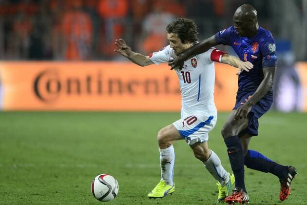 From left: Tomas Rosicky of Czech Republic and Bruno Martins Indi of Netherlands pictured during the Czech Republic vs Netherlands qualification match for football European Cup, Prague, Czech Republic, September 9, 2014. (CTKxPhoto MichalxKamaryt) CTKPhotoOF201409100973201  kmt archiv