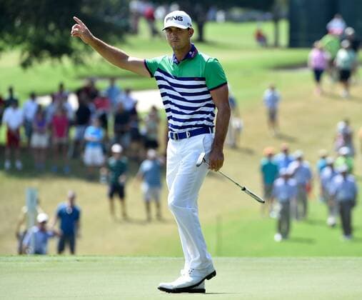 Early leader Billy Horschel signals a birdie on No. 2 after his long putt drops in the cup during the third round of the PGA Golf Herren Tour Championship at East Lake Golf Club on September 13, 2014, in Atlanta.  AJP2014091302