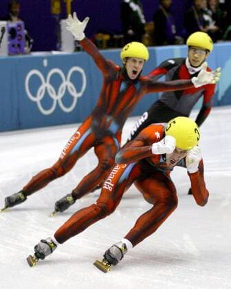 Feb 24, 2002; Salt Lake City, UT, USA; In a historic day for Canada, speed skaters Marc Gagnon, front, and Jonathan Guilmette reap Olympic gold and silver last night at the 500-metre short-track event in Salt Lake City. Soon after, they and their teammates went on to win gold in themen s 5,000-metre relay. Earlier, Clara Hughes won bronze. . 2002 Salt Lake City Winter Olympics  - ZUMAt14_