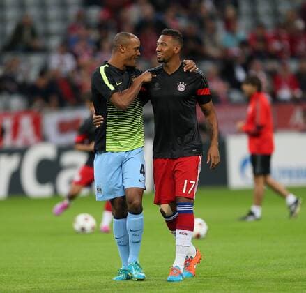 Manchester City s Vincent Kompany greets former teamate Bayern Munich s Jerome Boateng - Champions League Group E - Bayern Munich vs Manchester City - Allianz Arena - Germany - 17th September 2014 - Picture David Klein Sportimage EDITORIAL USE ONLY. No use with unauthorised audio, video, data, fixture lists, club league logos or live services. Online in-match use limited to 120 images, no video emulation. No use in betting, games or single club league player publications.