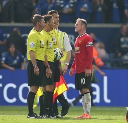 Wayne Rooney of Manchester United complains to referee Mark Clattenburg at the end of the match - Barclays Premier League - Leicester City vs Manchester Utd - King Power Stadium - Leicester - England - 21st September 2014 - Picture Simon Bellis Sportimage EDITORIAL USE ONLY. No use with unauthorised audio, video, data, fixture lists, club league logos or live services. Online in-match use limited to 120 images, no video emulation. No use in betting, games or single club league player publications.