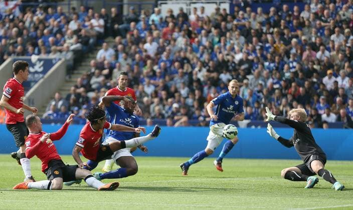 Radamel Falcao of Manchester United shot is saved by Kasper Schmeichel of Leicester City - Barclays Premier League - Leicester City vs Manchester Utd - King Power Stadium - Leicester - England - 21st September 2014 - Picture Simon Bellis Sportimage EDITORIAL USE ONLY. No use with unauthorised audio, video, data, fixture lists, club league logos or live services. Online in-match use limited to 120 images, no video emulation. No use in betting, games or single club league player publications.