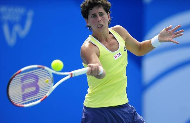 Spain s Carla Suarez Navarro hits a return during her women s singles match at the Wuhan Open tennis tournament in Wuhan, capital of central China s Hubei Province, on Sept. 23, 2014. ) (SP)CHINA-WUHAN-TENNIS-WUHAN OPEN HaoxTongqian 
