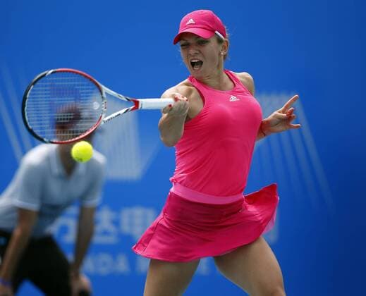 Simona Halep of Romania returns a shot during the women s singles second round of the 2014 WTA Tennis Damen Wuhan Open tennis tournament in Wuhan city, central China s Hubei province, 23 September 2014.  20140923_28263