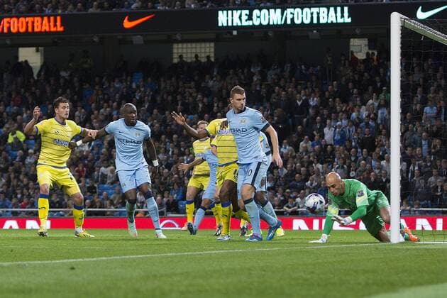 Willy Caballero of Manchester City fumbles a strike from Wednesday s Giles Coke - Manchester City vs. Sheffield Wednesday - Capital One League Cup - Anfield - Liverpool - 24 09 2014 EDITORIAL USE ONLY. No use with unauthorised audio, video, data, fixture lists, club league logos or live services. Online in-match use limited to 120 images, no video emulation. No use in betting, games or single club league player publications.