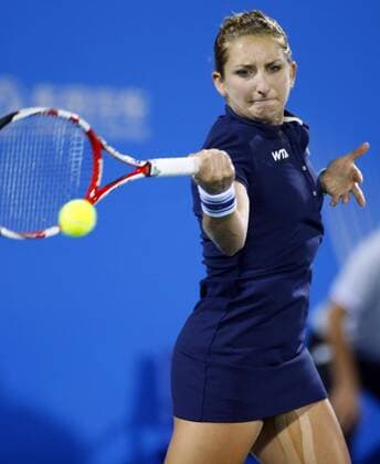 Timea Bacsinszky of Switzerland returns a shot during the women s singles quarter-final of the 2014 WTA Tennis Damen Wuhan Open tennis tournament in Wuhan city, central China s Hubei province, 25 September 2014.  20140925_13204