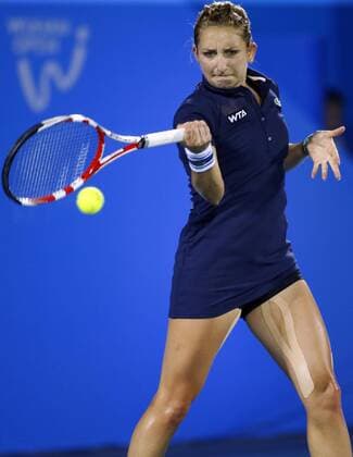 Timea Bacsinszky of Switzerland returns a shot during the women s singles quarter-final of the 2014 WTA Tennis Damen Wuhan Open tennis tournament in Wuhan city, central China s Hubei province, 25 September 2014.  20140925_48101