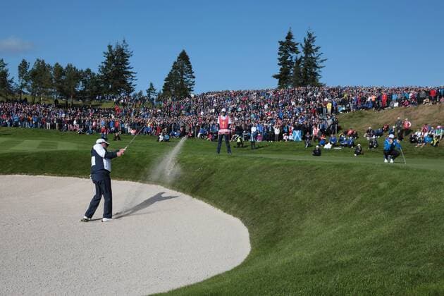 USA s Phil Mickelson hits out of the bunker on the 14th green in the morning fourball match against Europe s Rory McIlroy ( Mc Ilroy ) and Sergio Garcia on the first day of the 2014 Ryder Cup in Gleneagles,Scotland on September 26, 2014.  LON2014092632