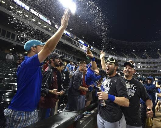 Sept. 26, 2014 - Chicago, IL, USA - The Kansas City Royals Mike Moustakas and Billy Butler celebrate with fans after the team clinches a wild card spot following a 3-1 win against the Chicago White Sox on Friday, Sept. 26, 2014, at U.S. Cellular Field in Chicago. The postseason berth is the Royals first in 29 years. Kansas City at Chicago White Sox - ZUMAm67_