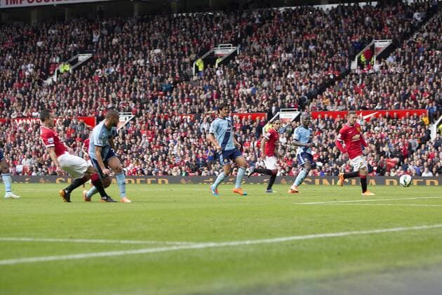 Robin van Persie of Manchester United scores his sides second goal - Manchester United vs. West Ham United - Barclay s Premier League - Old Trafford - Manchester - 27 09 2014 Pic Philip Oldham Sportimage EDITORIAL USE ONLY. No use with unauthorised audio, video, data, fixture lists, club league logos or live services. Online in-match use limited to 120 images, no video emulation. No use in betting, games or single club league player publications.