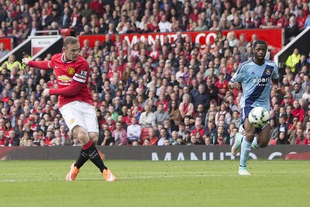 Wayne Rooney of Manchester United strikes at goal - Manchester United vs. West Ham United - Barclay s Premier League - Old Trafford - Manchester - 27 09 2014 Pic Philip Oldham Sportimage EDITORIAL USE ONLY. No use with unauthorised audio, video, data, fixture lists, club league logos or live services. Online in-match use limited to 120 images, no video emulation. No use in betting, games or single club league player publications.