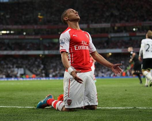 Arsenal s Kieran Gibbs looks on dejected - Barclays Premier League - Arsenal vs Tottenham Hotspur - Emirates Stadium - England - 27th September 2014 - EDITORIAL USE ONLY. No use with unauthorised audio, video, data, fixture lists, club league logos or live services. Online in-match use limited to 120 images, no video emulation. No use in betting, games or single club league player publications.