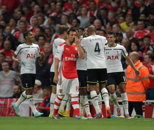 Arsenal FC London - Tottenham Hotspur Nacer Chadli (TH) celebrates scoring a goal for Tottenham as Santi Cazorla (A) is dejected. 0-1 