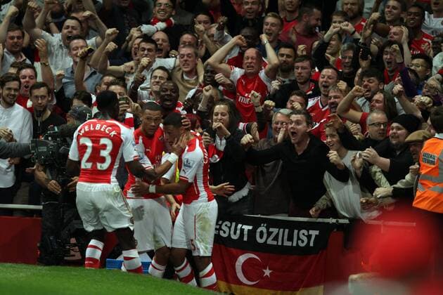 Arsenal FC London - Tottenham Hotspur Arsenal fans go wild as Alex Oxlade-Chamberlain (A) celebrates scoring a goal for Arsenal with Kieran Gibbs (A). 1-1 