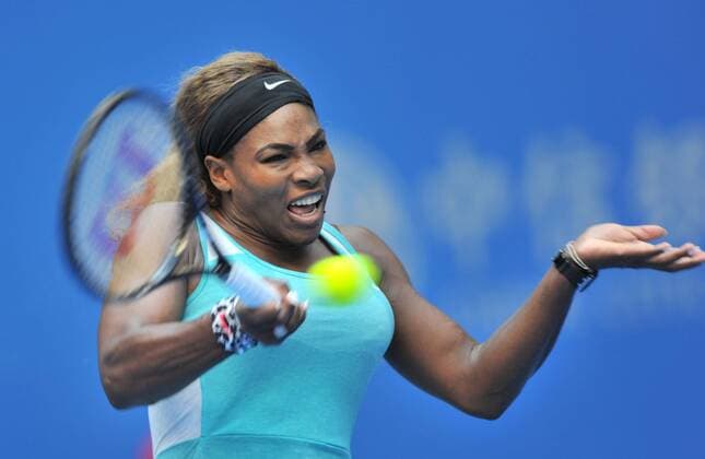 Serena Williams of the United States returns a shot during the women s 1st round match at the 2014 China Open in Beijing, capital of China, on Sept. 29, 2014. (SP)CHINA-BEIJING-TENNIS-CHINA OPEN LixWen 