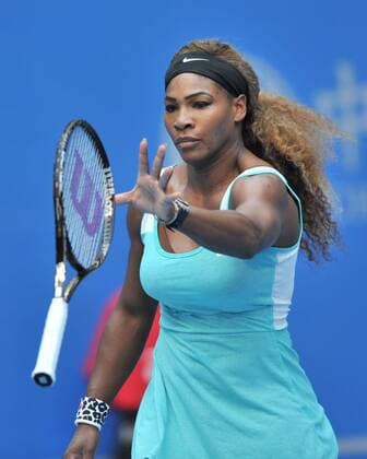 Serena Williams of the United States throws her racket during the women s 1st round match at the 2014 China Open in Beijing, capital of China, on Sept. 29, 2014. (SP)CHINA-BEIJING-TENNIS-CHINA OPEN LixWen 