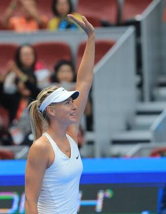 Maria Sharapova of Russia celebrates after the women s 2nd round match at the 2014 China Open in Beijing, capital of China, on Sept. 30, 2014. XingxGuangli 