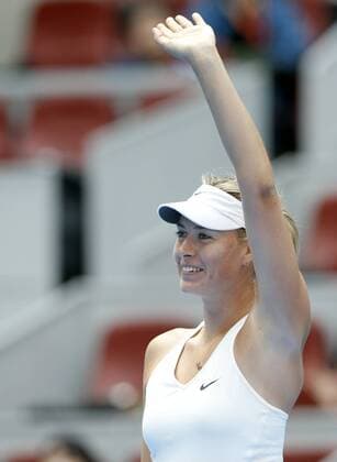 Maria Sharapova of Russia celebrates after the women s 2nd round match at the 2014 China Open in Beijing, capital of China, on Sept. 30, 2014. ChenxJianli 
