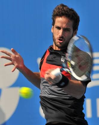 Feliciano Lopez of Spain returns a shot during the men s singles 1st round match at the 2014 China Open in Beijing, capital of China, on Sept. 30, 2014. LixWen 