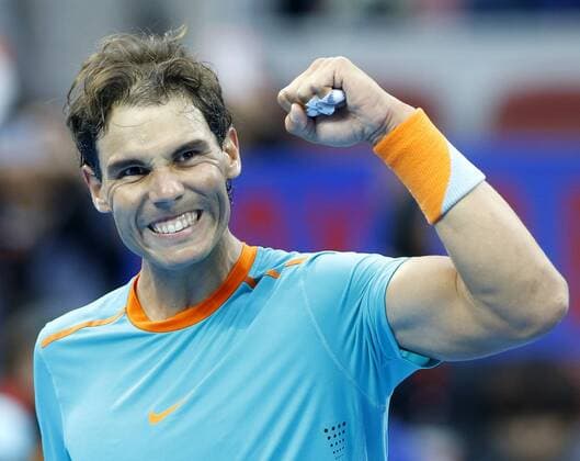 Rafael Nadal of Spain celebrates for victory after winning the men s singles 1st round match at the 2014 China Open in Beijing, capital of China, on Sept. 30, 2014. ChenxJianLi 