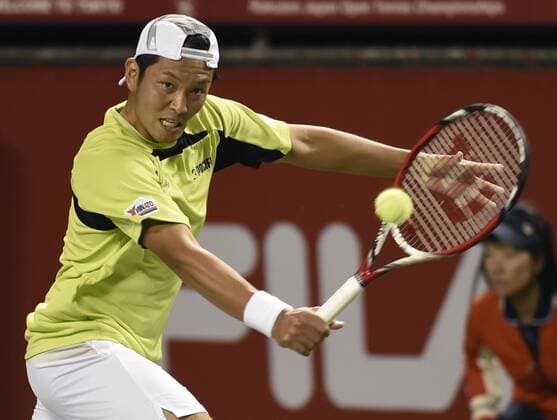 (141001) -- TOKYO, Oct. 1, 2014 -- Tatsuma Ito of Japan hits a return during the second round match at the Rakuten Japan Open Tennis Championships 2014 in Tokyo, Japan, Oct. 1, 2014. 