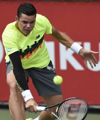 (141002) -- TOKYO, Oct. 2, 2014 -- Milos Raonic of Canada hits a return during the second round match at the Rakuten Japan Open Tennis Championships 2014 in Tokyo, Japan, Oct. 2, 2014. 