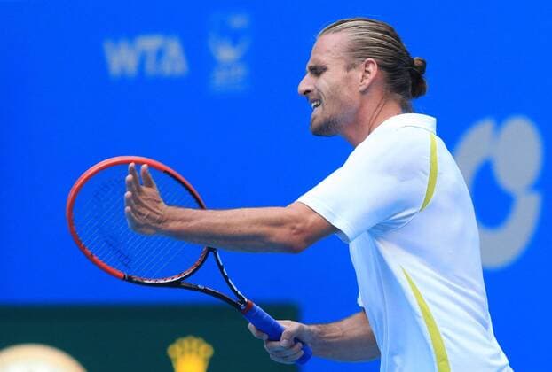 (141002) -- BEIJING, Oct. 2, 2014 -- Peter Gojowczyk of Germany reacts during the men s singles 2nd round match at the China Open tennis tournament in Beijing, China, Oct. 2, 2014. XingxGuangli 