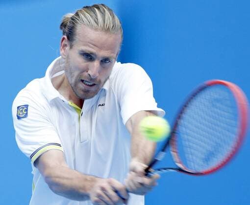 (141002) -- BEIJING, Oct. 2, 2014 -- Peter Gojowczyk of Germany returns a shot during the men s singles 2nd round match at the China Open tennis tournament in Beijing, China, Oct. 2, 2014. ChenxJianli 