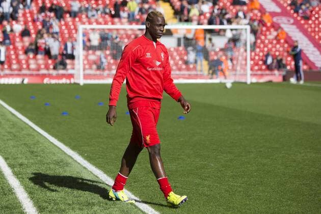 Mario Balotelli of Liverpool strolls out for warm up - Liverpool vs. West Bromwich Albion - Barclay s Premier League - Anfield - Liverpool - 04 10 2014 Pic Philip Oldham Sportimage EDITORIAL USE ONLY. No use with unauthorised audio, video, data, fixture lists, club league logos or live services. Online in-match use limited to 120 images, no video emulation. No use in betting, games or single club league player publications.