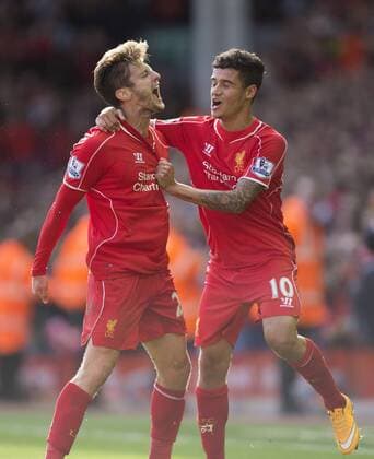 Adam Lallana of Liverpool celebrates his opening goal - FC Liverpool vs. West Bromwich Albion - Barclay s Premier League - Anfield - Liverpool - 04 10 2014 EDITORIAL USE ONLY. No use with unauthorised audio, video, data, fixture lists, club league logos or live services. Online in-match use limited to 120 images, no video emulation. No use in betting, games or single club league player publications.