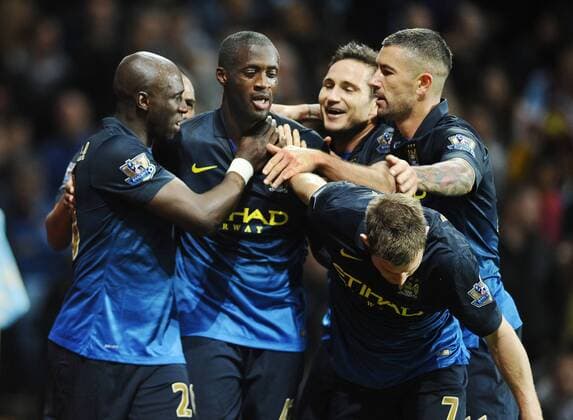 Football - 2014 2015 Premier League - Aston Villa vs. Manchester City City s Yaya Toure celebrates his goal with Frank Lampard and friends at Villa Park. COLORSPORT ANDREWxCOWIE 