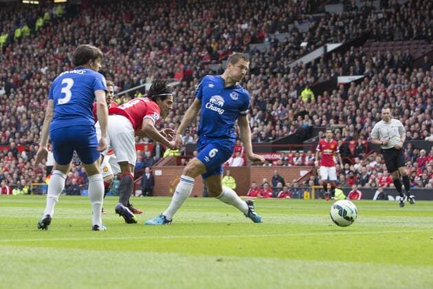 Radamel Falcao of Manchester United gets an early header at goal - Manchester United vs. Everton - Barclay s Premier League - Old Trafford - Manchester - 04 10 2014 Pic Philip Oldham Sportimage EDITORIAL USE ONLY. No use with unauthorised audio, video, data, fixture lists, club league logos or live services. Online in-match use limited to 120 images, no video emulation. No use in betting, games or single club league player publications.