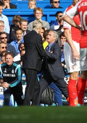 Football - 2014 2015 Premier League - Chelsea vs. Arsenal Jose Mourinho, Manager, of Chelsea FC and Arsene Wenger,Manager, of Arsenal FC get physical at Stamford Bridge Colorsport Daniel Bearham  CHE_ARS