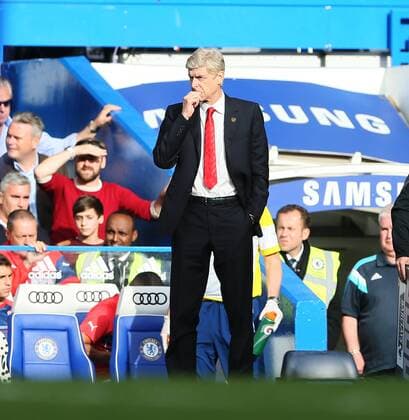 Arsenal s Arsene Wenger looks on - Barclays Premier League - Chelsea Vs Arsenal - Stamford Bridge - England - 5th October 2014 - EDITORIAL USE ONLY. No use with unauthorised audio, video, data, fixture lists, club league logos or live services. Online in-match use limited to 120 images, no video emulation. No use in betting, games or single club league player publications.
