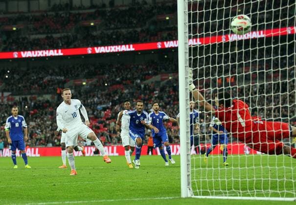 England s Wayne Rooney scoring his sides second goal - Euro 2016 Qualification - England vs San Marino - Wembley Stadium - England - 9th October 2014 - Picture David Klein Sportimage EDITORIAL USE ONLY. No use with unauthorised audio, video, data, fixture lists, club league logos or live services. Online in-match use limited to 120 images, no video emulation. No use in betting, games or single club league player publications.