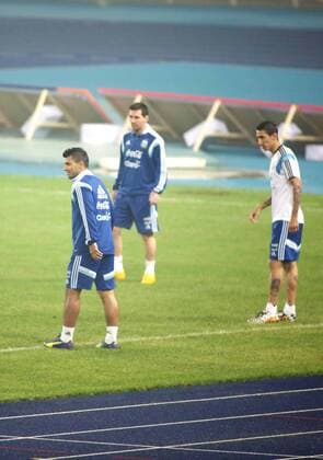 (From left) Sergio Kun Aguero, Lionel Messi and Angel Fabian Di Maria of Argentina take part in a training session in heavy smog for the Americas Super Derby - also known as Superclasico de las Americas, in Beijing, 9 October 2014.  20141009_11659